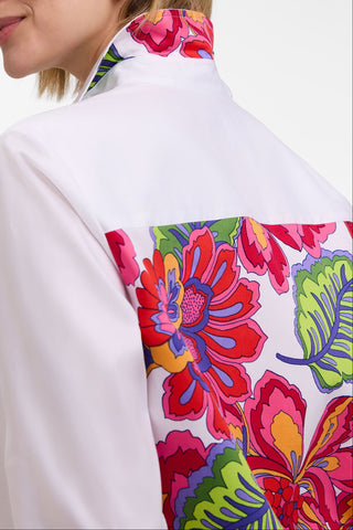Angled back view of the Meghan Plus Paradise Blooms 3/4 Sleeve Shirt showing the bold pattern under the collar and down the back of the shirt 