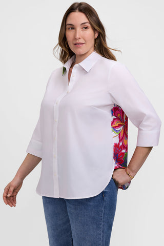 Angled front view of model wearing the Meghan Plus Paradise Blooms 3/4 Sleeve Shirt to show a pop of the pattern under the arm 