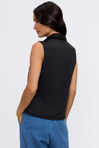 Angled back view of model wearing the Taylor Knit-Woven Sleeveless Layering Tank #color_black