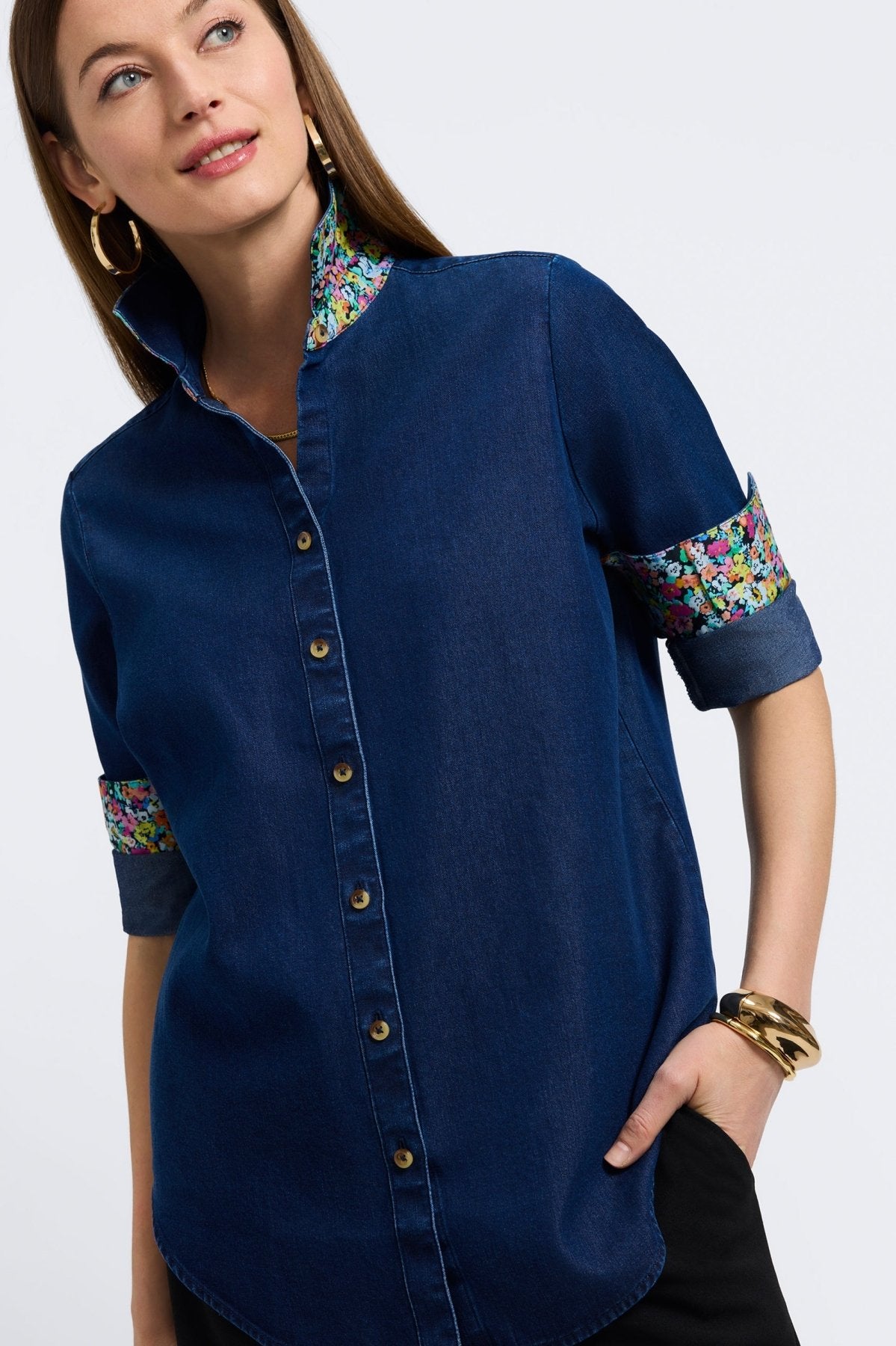 Woman in a dark denim button-down shirt from Foxcroft, offering effortless style with a timeless, wear-anywhere look.