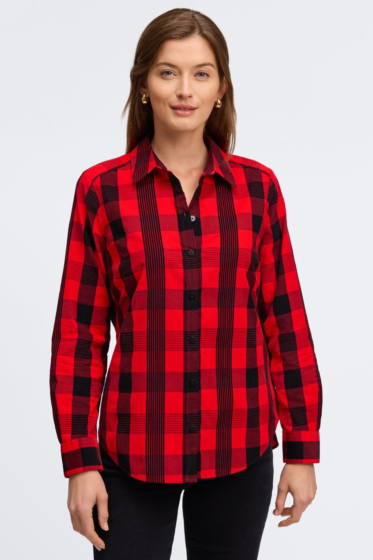 Woman wearing Foxcroft shirt in bold red and black print with modern styling.