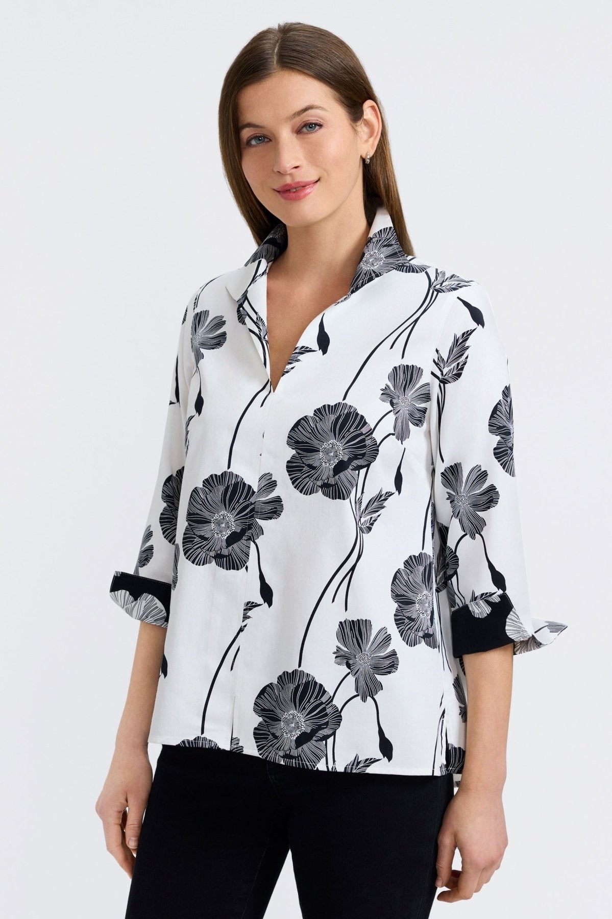 Woman in Foxcroft Agnes Light Black Poppy blouse, floral print on airy fabric for easy day-to-night wear.