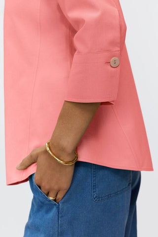 Close-up of the 3/4 sleeve on the Paityn shirt in #color_coral reef