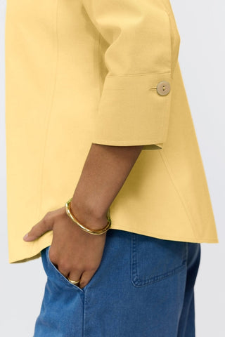 Close-up of the 3/4 sleeve on the Paityn shirt in #color_lemon