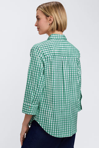 Angled back view of model wearing the Margie Gingham Stretch Matte Sateen 3/4 Sleeve Shirt untucked with jeans #color_kelly green/white gingham