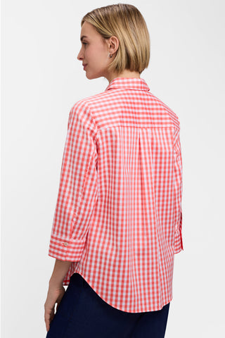 Angled back view of a model wearing the Margie Gingham Stretch Matte Sateen 3/4 Sleeve Shirt #color_georgia peach/white gingham