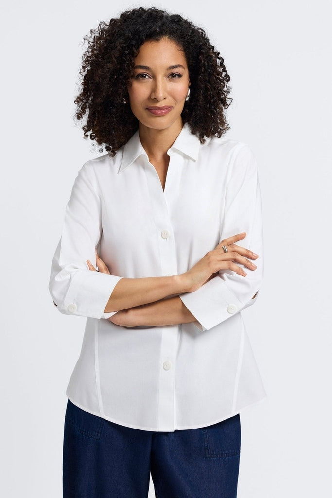 Woman with folded arms wearing the Paityn pinpoint 3/4 sleeve shirt in #color_white