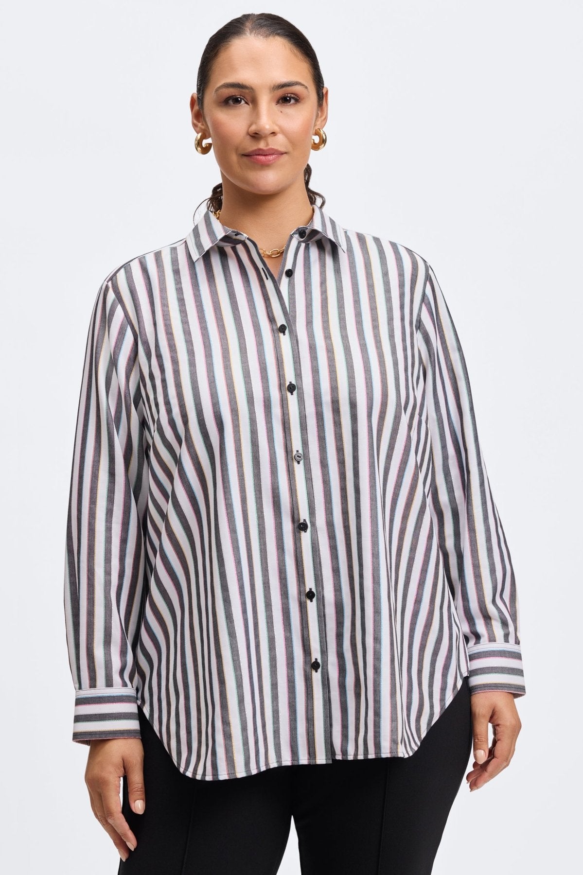 Plus-size woman wearing a striped, no-iron button-down shirt by Foxcroft, featuring a relaxed fit for effortless style and comfort.