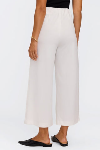 angled back view of the wide leg pants #color_ecru