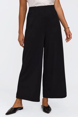 Waist down view of the wrinkle resistant wide leg ankle pants #color_black
