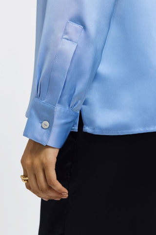 Buttoned cuff and sleeve of the Bianca beyond silk shirt #color_bel air blue