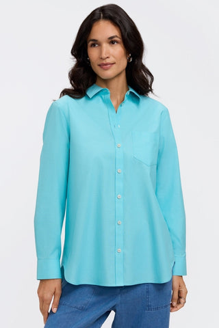 Front view of woman wearing the Boyfriend Pinpoint Non-Iron Tunic #color_capri