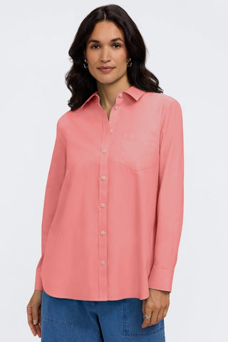 Front view of a woman wearing the Boyfriend Pinpoint Non-Iron Tunic #color_coral reef