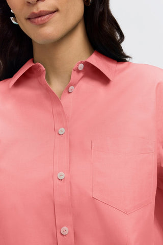 Close up view of the top half of the Boyfriend Pinpoint Non-Iron Tunic #color_coral reef