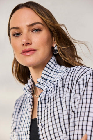 Close up of ruffled neck and fabric covered buttons of Crinkle shirt jacket