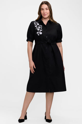 Front view of model wearing the Esther Plus Floral Embroidery Elbow Sleeve Dress
showing off its elegance 