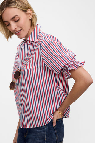 Side view of model wearing the Vivienne Tricolor Classic Elbow Sleeve Shirt with a pair of jeans and the textured sleeves 