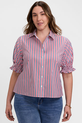 Front view of model wearing the Vivienne Plus Tricolor Classic Elbow Sleeve Shirt
featuring the volume adding ruffles of the sleeves 