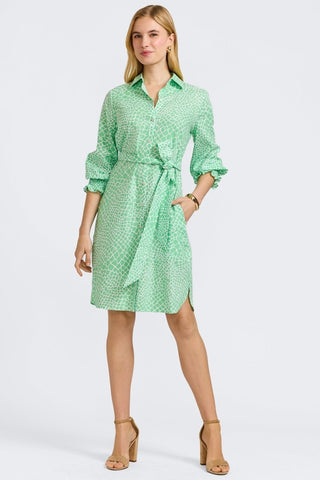 Woman in Foxcroft Abby linen giraffe print dress in New Leaf green, breathable and stylish