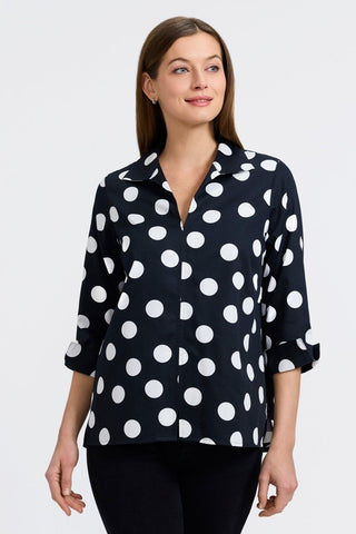 Woman in Foxcroft Agnes Polka Dot Shirt in black and white, timeless dot print with effortless versatility.