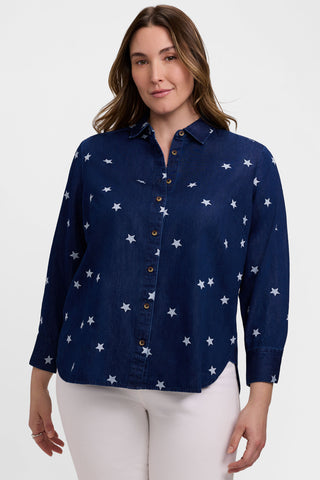 Front view of model wearing the Meghan Plus Tencel Star Embroidery Long Sleeve Shirt with a pair of white pants for an Americana feel 