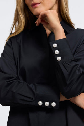 Close up of oversized triple-button cuffs on the Pearl Stretch Matte Sateen Long Sleeve Shirt #color_black