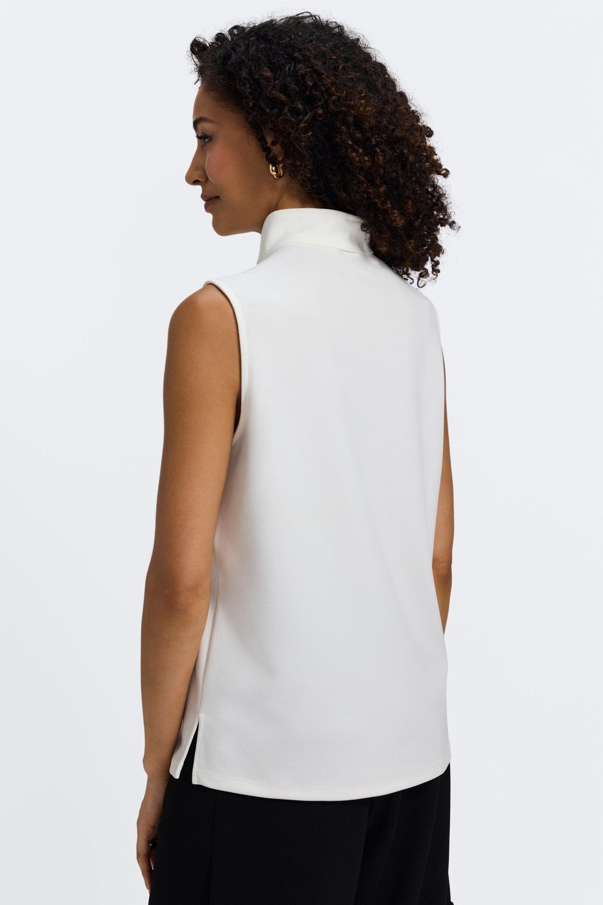 Woman in Foxcroft Tammy sleeveless knit crepe top in ecru