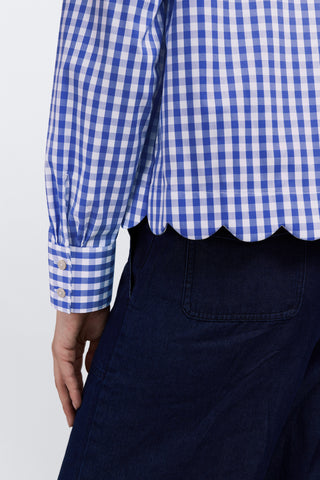 Close up on the triple pleated sleeves and scalloped hem of the Scarlett Plus Gingham Stretch Matte Sateen Long Sleeve Shirt #color_deep sea/white gingham