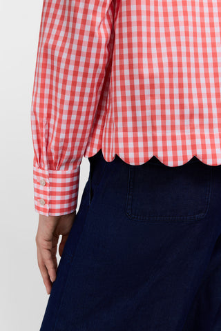 Close back view of the scalloped hem and triple pleated cuffs on the Scarlett Gingham Stretch Matte Sateen Long Sleeve Shirt #color_georgia peach/white gingham