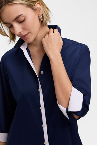 Model wearing the Charlie White Trim 3/4 Sleeve Shirt showing the bright white placket and underside of the folded back sleeves #color_navy