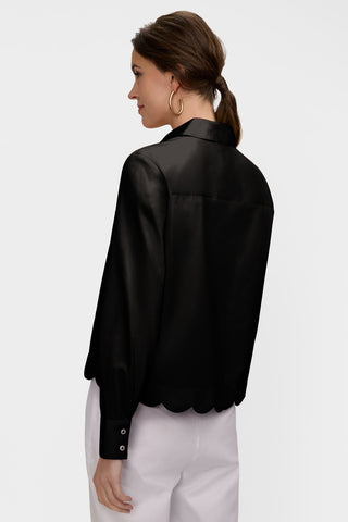 Angled back view of model wearing Scarlett Stretch Matte Sateen Long Sleeve Shirt #color_black