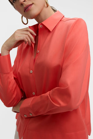 Close up of the top half of the Scarlett Stretch Matte Sateen Long Sleeve Shirt
worn with the top two buttons undone for a deeper neckline #color_georgia peach