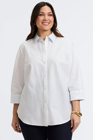Plus-size woman in a white dooby stripe shirt from Foxcroft, soft and striking with a refined vibe.