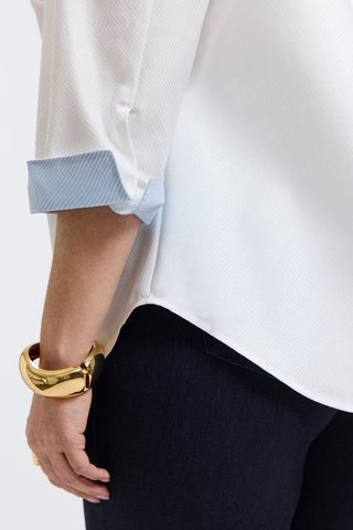 Plus-size woman in a white dooby stripe shirt from Foxcroft, soft and striking with a refined vibe.