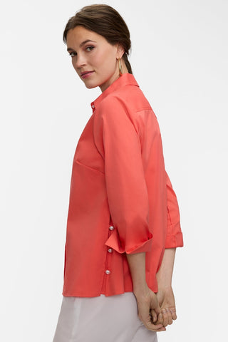 Side view of the Beatrice Pearl Stretch Matte Sateen 3/4 Sleeve Shirt showing it's side slit and turnback arm cuffs #color_georgia peach