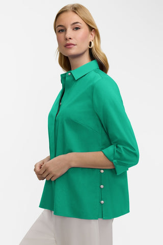 Angled side view of the Beatrice Pearl Stretch Matte Sateen 3/4 Sleeve Shirt worn with it's cuffs turned back #color_kelly green