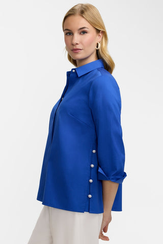 Side view of the Beatrice Pearl Stretch Matte Sateen 3/4 Sleeve Shirt featuring the side slit and turned back arm cuffs #color_deep sea
