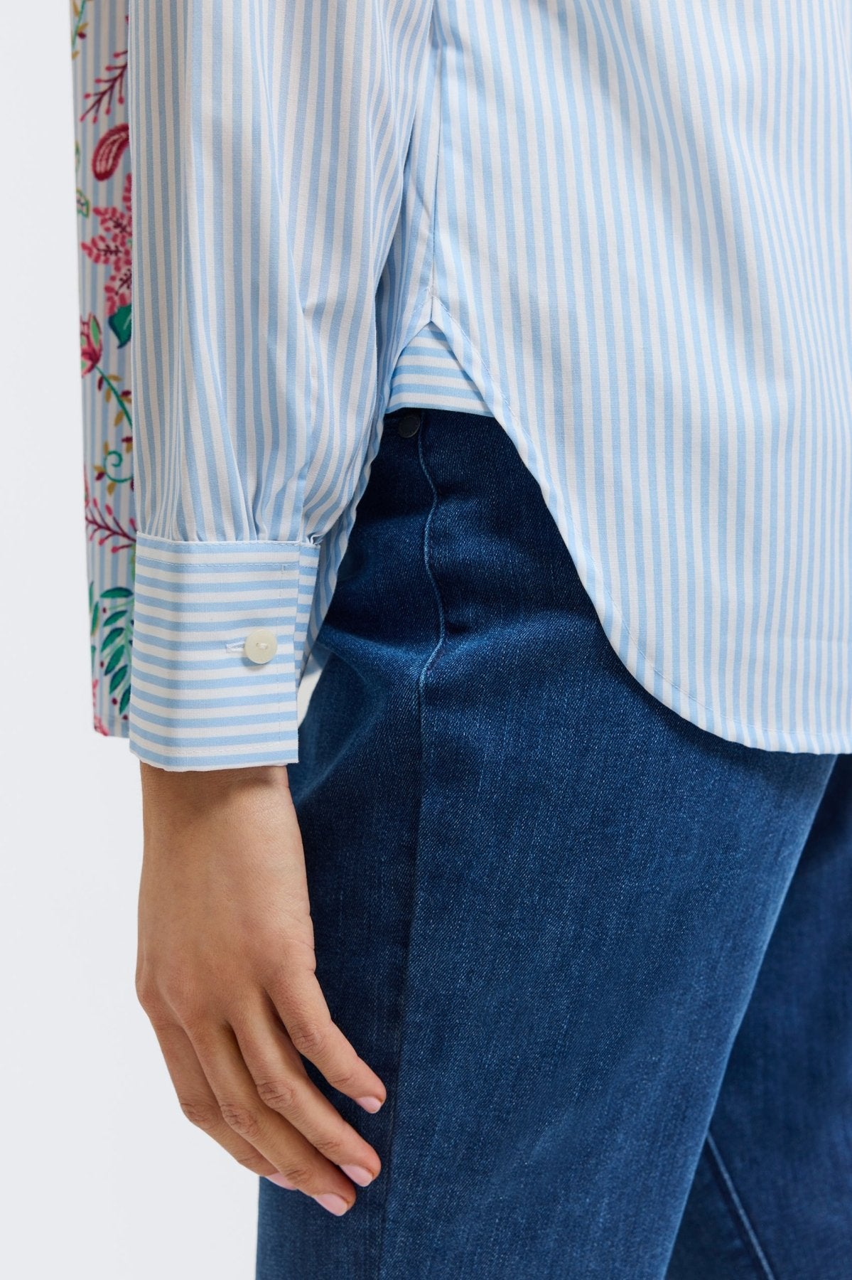 Plus-size woman in a blue floral stripe button-down from Foxcroft, offering cheerful sophistication with breathable ease. (12)
