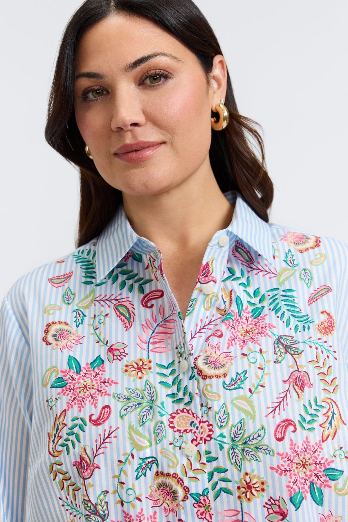 Plus-size woman in a blue floral stripe button-down from Foxcroft, offering cheerful sophistication with breathable ease. (11)