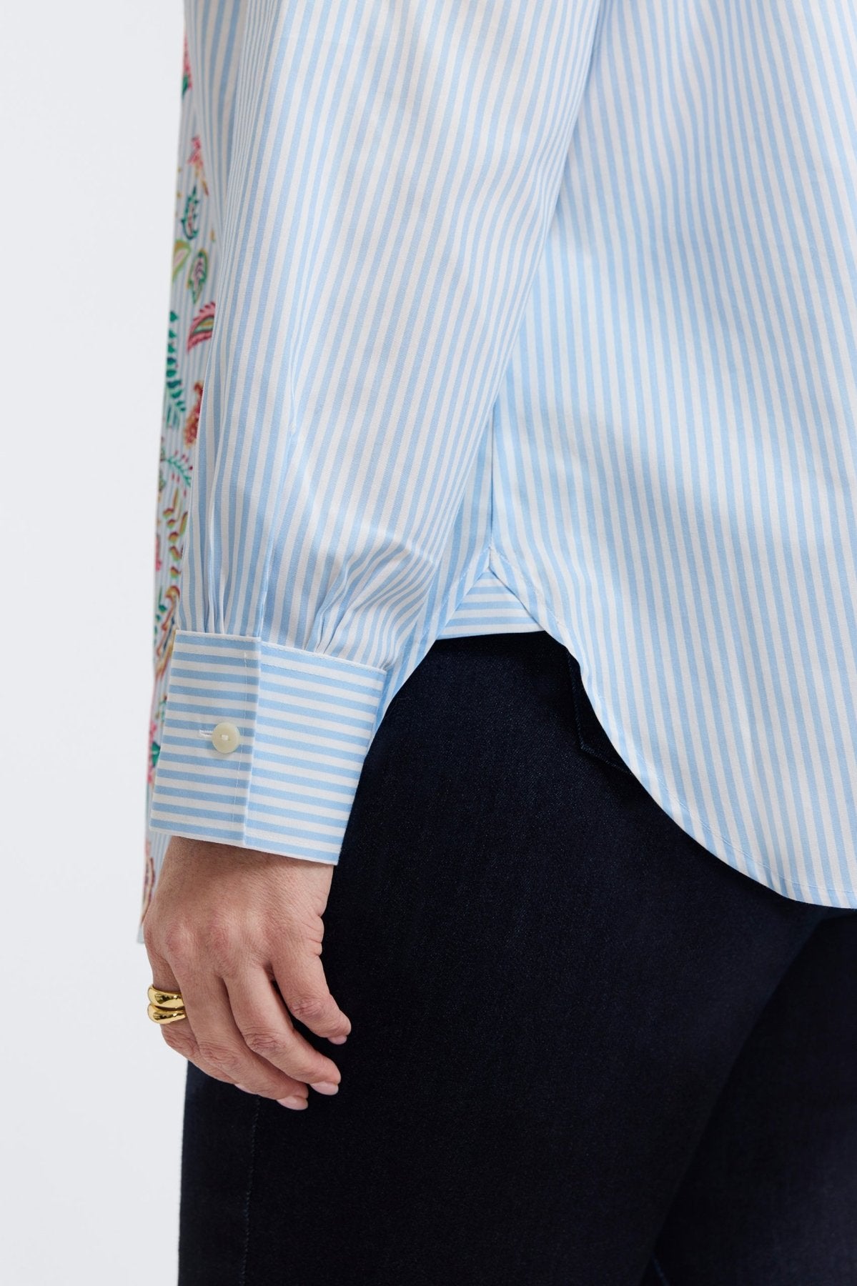 Plus-size woman in a blue floral stripe button-down from Foxcroft, offering cheerful sophistication with breathable ease. (6)