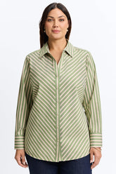 Plus-size woman in a green no-iron button-down shirt from Foxcroft, perfect for all-day ease.