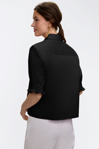 Angled back view of the Vivienne Stretch Matte Sateen Elbow Sleeve Shirt #color_black