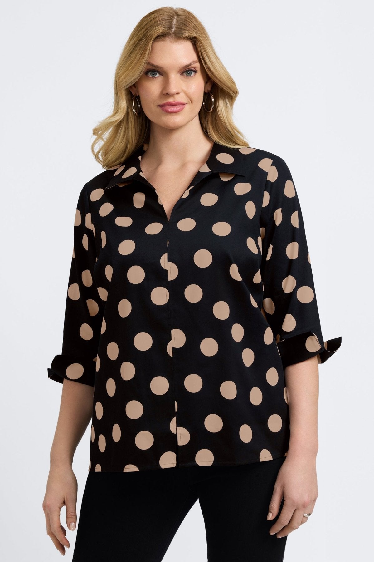 Woman wearing Foxcroft Agnes shirt in black with almond dot print, modern and versatile.