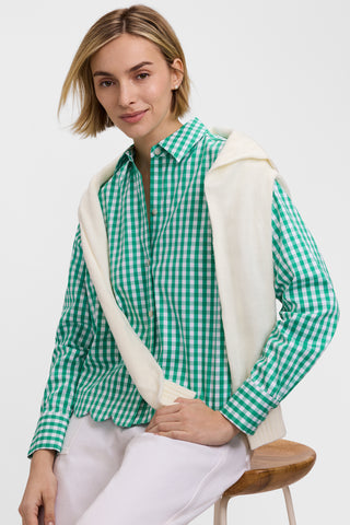 Front view of model sitting on a stool wearing the Scarlett Gingham Stretch Matte Sateen Long Sleeve Shirt
 with a white sweater draped over her shoulders #color_kelly green/white gingham
