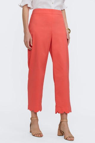 Waist down view of model wearing matte scalloped cuff capris #color_georgia peach