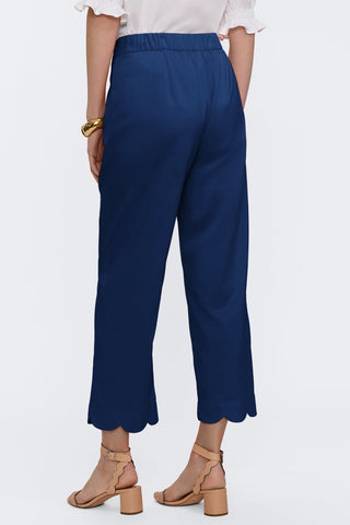 Angled back view of the satin matte capris #color_navy