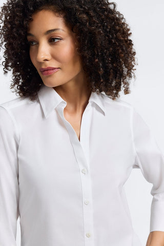 Zoomed in view of a woman wearing the Mary No Iron Stretch 3/4 Sleeve Shirt showing the neckline and collar #color_white