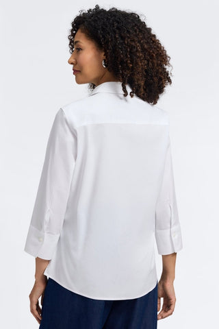 Back view of a woman wearing the Mary No Iron Stretch 3/4 Sleeve Shirt #color_white