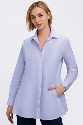Front view of a woman wearing the Cici No Iron Pinpoint Long Sleeve Tunic with her hand in one of the shirts pockets #color_blue wave