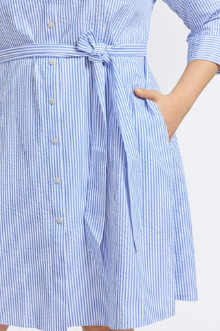 Plus-size woman in a blue double-stripe button-down shirt from Foxcroft, polished and practical with non-iron ease. (2)